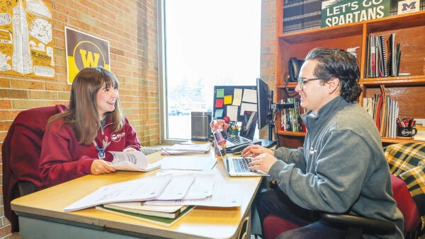 Director Fernando Monge and Postsecondary Success Coach Katrina Groeller meeting